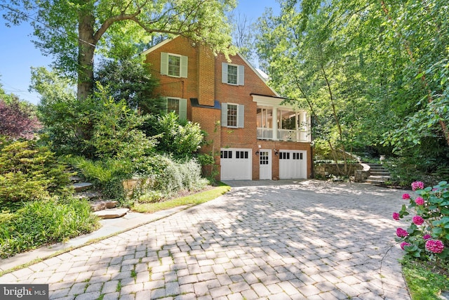 view of side of home with a garage