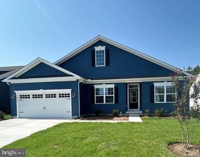 view of front of house featuring a front yard and a garage