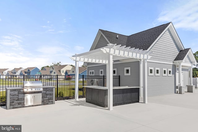 view of patio / terrace with exterior kitchen, area for grilling, central air condition unit, and a pergola