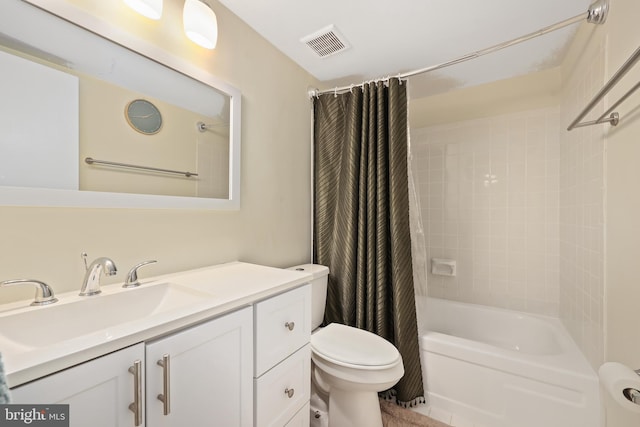 full bathroom with shower / tub combo with curtain, vanity, and toilet