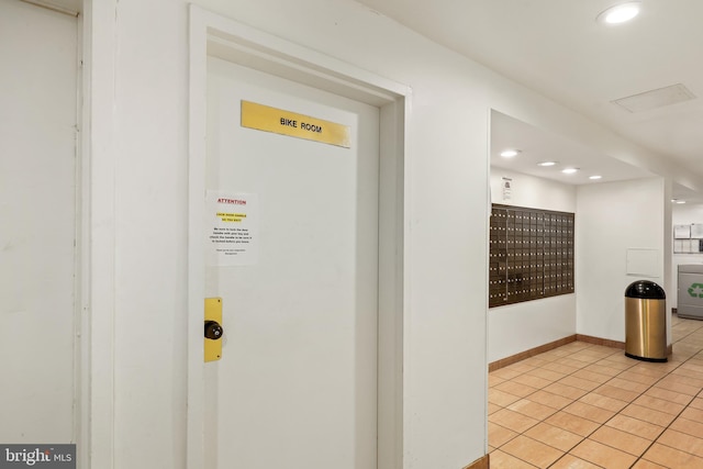 view of community featuring washer / dryer and a mail area