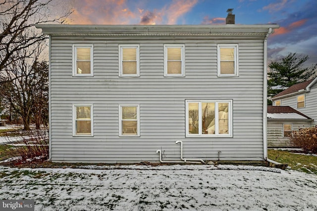 view of snow covered house