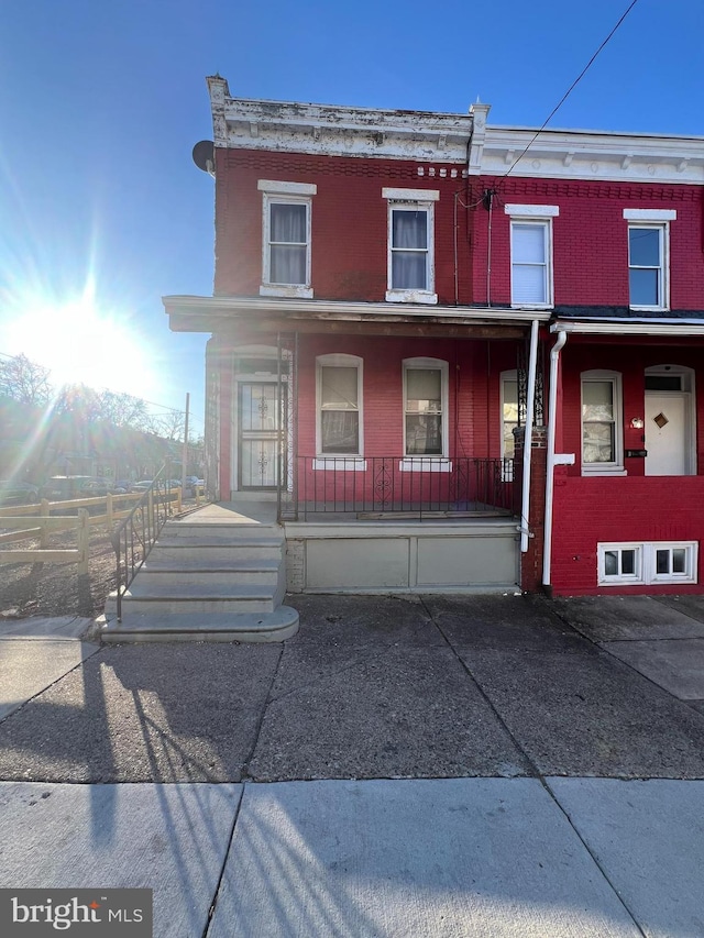 townhome / multi-family property with covered porch