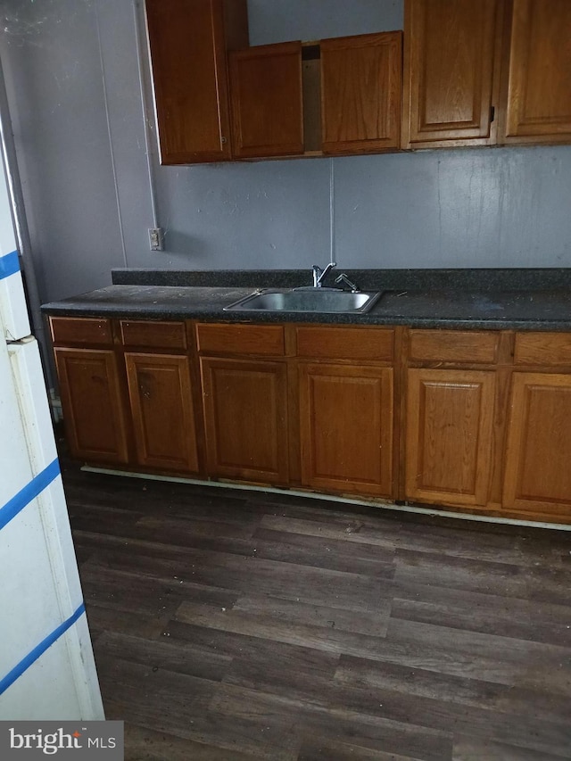 kitchen featuring sink and dark hardwood / wood-style floors