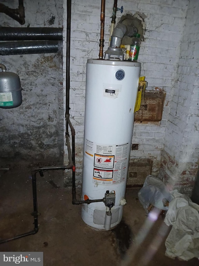 utility room featuring water heater