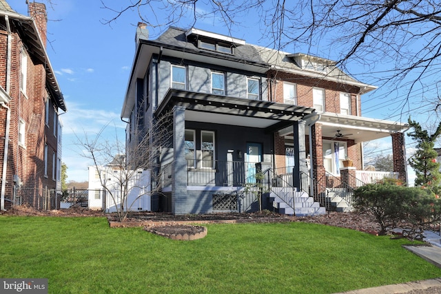 view of front of home with a porch and a front lawn