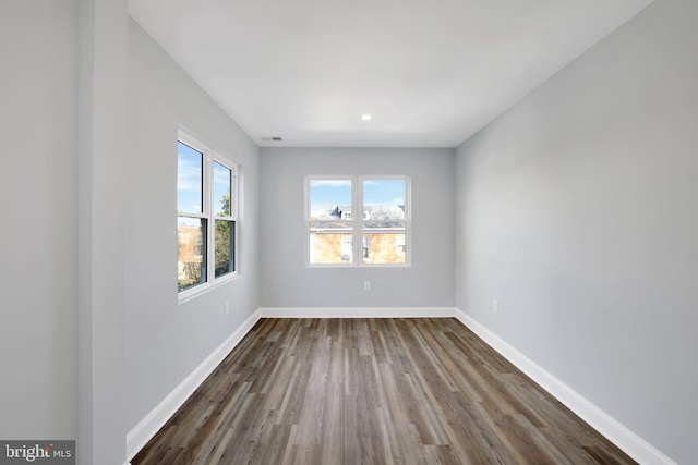 empty room featuring dark hardwood / wood-style floors