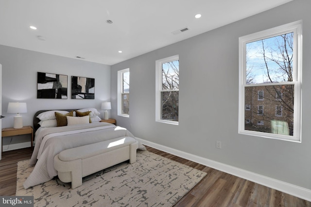 bedroom with wood-type flooring