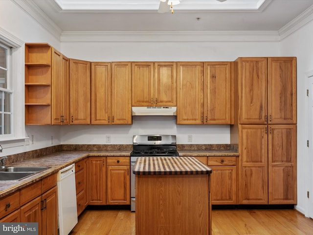 kitchen featuring a kitchen island, stainless steel gas stove, sink, ornamental molding, and white dishwasher