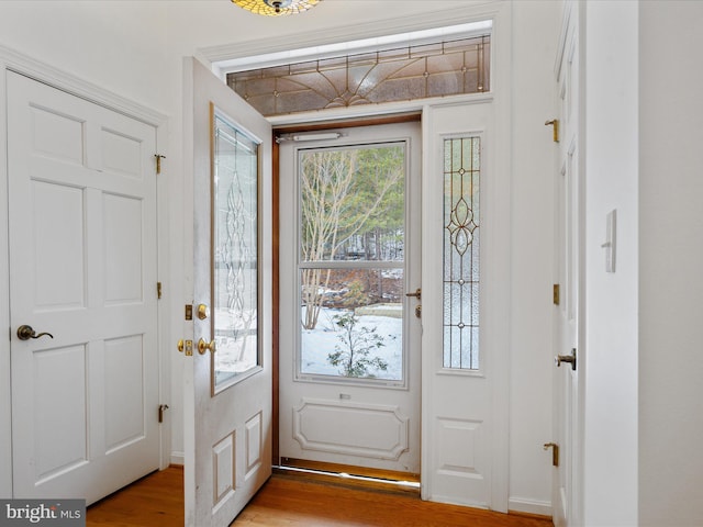 foyer entrance with light hardwood / wood-style floors