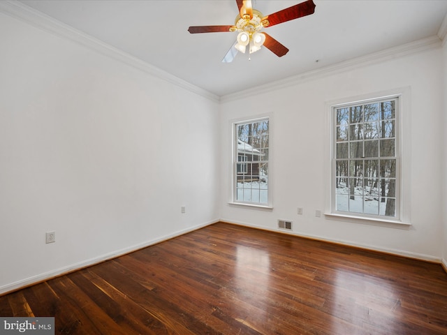 empty room with ceiling fan, crown molding, and dark hardwood / wood-style floors