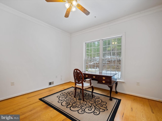 office featuring ceiling fan, light hardwood / wood-style flooring, and crown molding