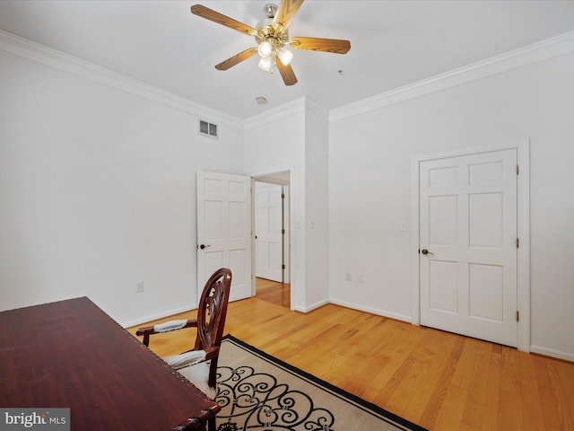 office space with ceiling fan, ornamental molding, and wood-type flooring