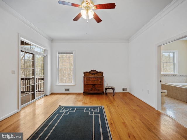 unfurnished room featuring ceiling fan, crown molding, and wood-type flooring