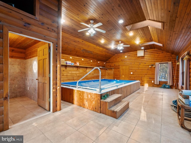 playroom with ceiling fan, wooden ceiling, light tile patterned floors, and log walls