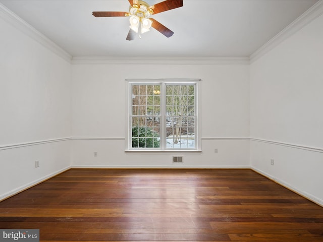 empty room featuring ceiling fan, dark hardwood / wood-style flooring, and crown molding