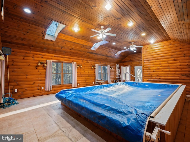 tiled bedroom with wood ceiling, log walls, lofted ceiling with skylight, and ceiling fan