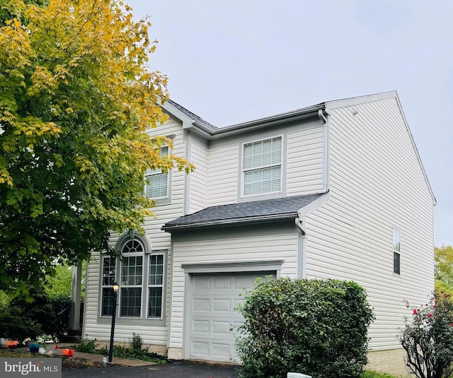 view of side of property featuring a garage