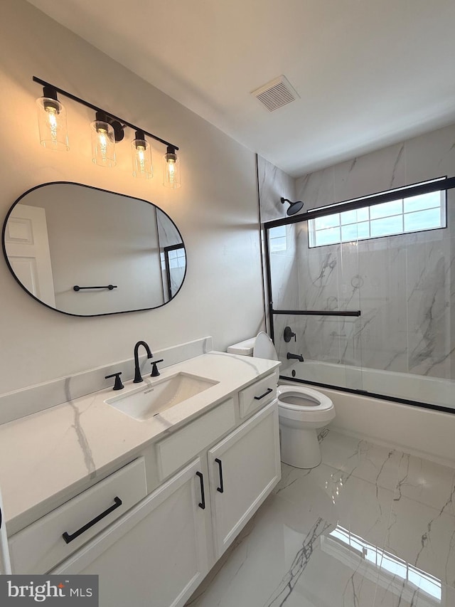 full bathroom with toilet, enclosed tub / shower combo, and vanity