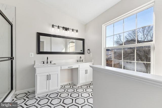 bathroom with an enclosed shower and vanity