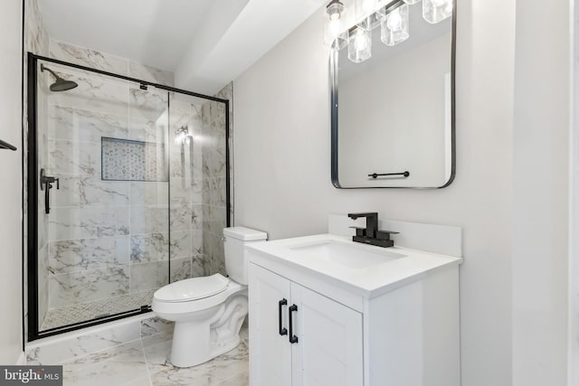 bathroom with a shower with shower door, toilet, and vanity