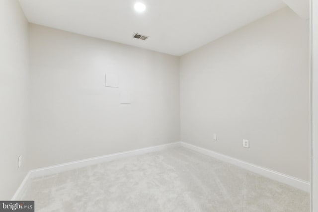 unfurnished room with light carpet