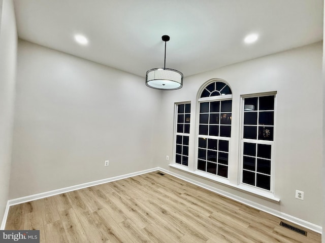 unfurnished dining area featuring light hardwood / wood-style flooring