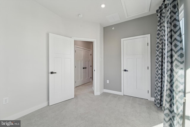 unfurnished bedroom featuring light colored carpet