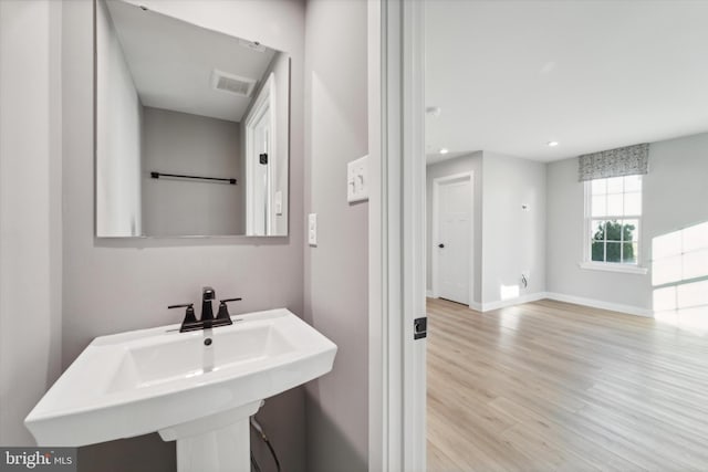 bathroom featuring sink and hardwood / wood-style flooring