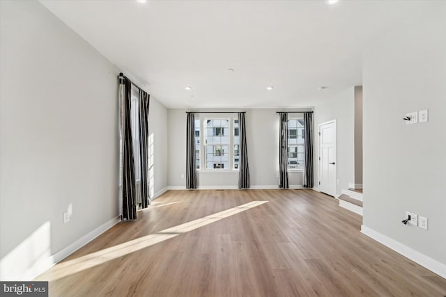 unfurnished living room featuring light hardwood / wood-style floors