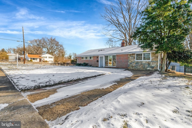 view of snow covered house