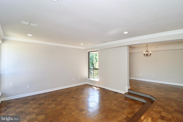 empty room featuring dark parquet floors, crown molding, and a notable chandelier