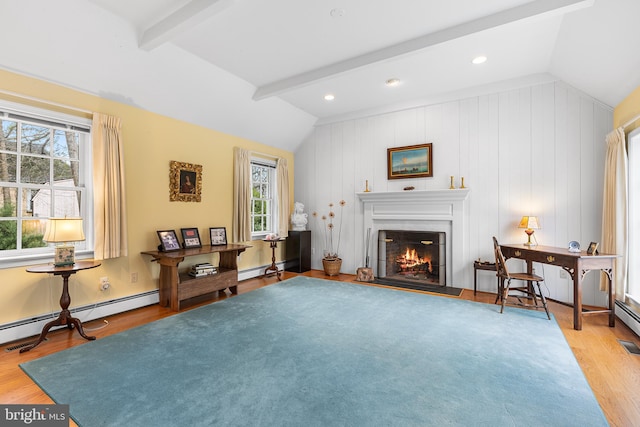 living area with a baseboard radiator, wood-type flooring, and vaulted ceiling with beams