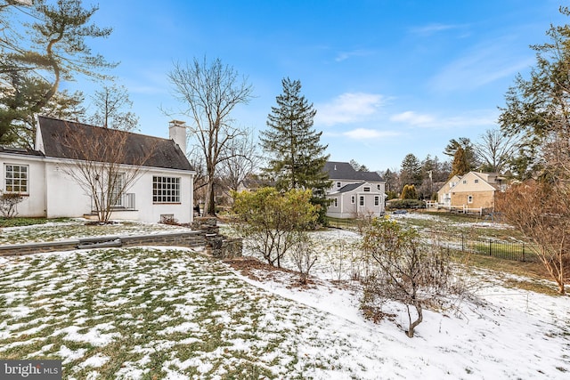 view of yard covered in snow