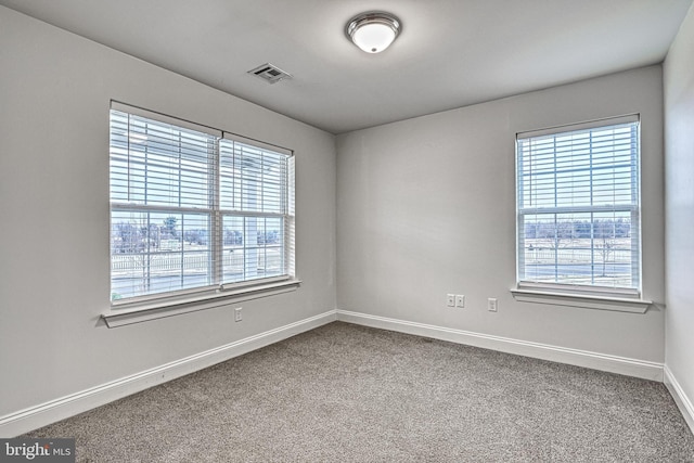 empty room featuring carpet flooring