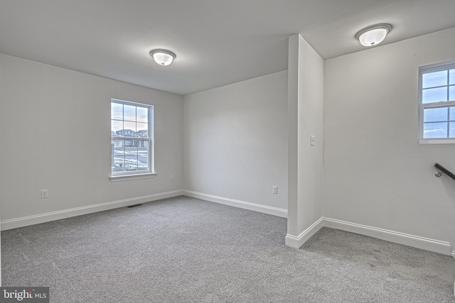 empty room with carpet flooring