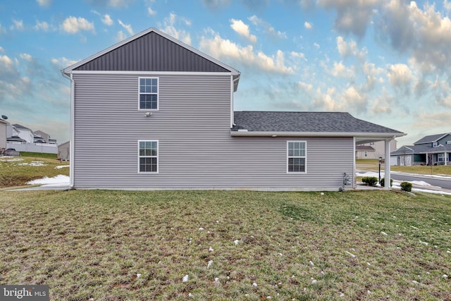 view of home's exterior featuring a lawn