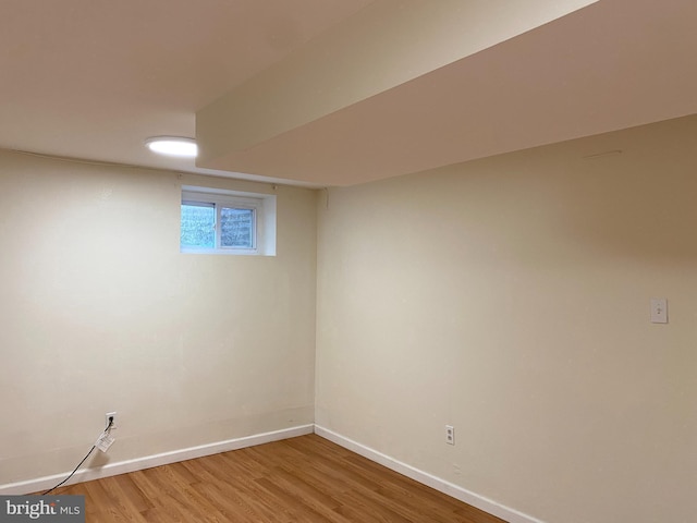 basement featuring hardwood / wood-style flooring