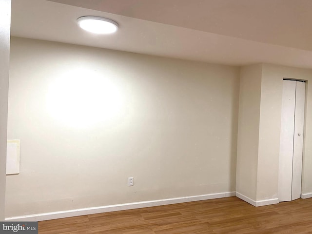 unfurnished room featuring wood-type flooring