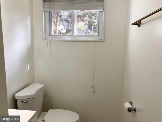 bathroom featuring toilet and vanity