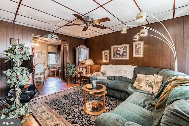 living room featuring ceiling fan and hardwood / wood-style flooring