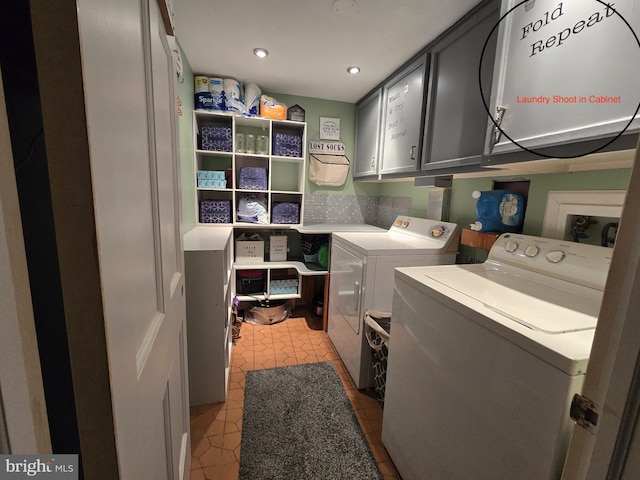 laundry room with cabinets, separate washer and dryer, and light tile patterned floors