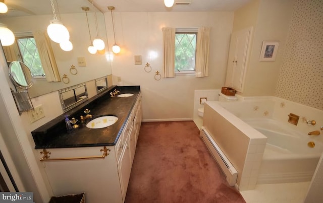 bathroom featuring vanity, a baseboard radiator, a washtub, and plenty of natural light