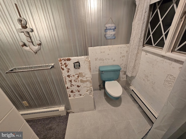 bathroom featuring baseboard heating, tile patterned floors, and toilet