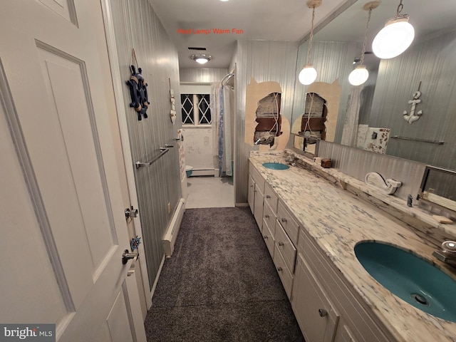 bathroom with a shower with curtain, a baseboard heating unit, tile patterned flooring, and vanity