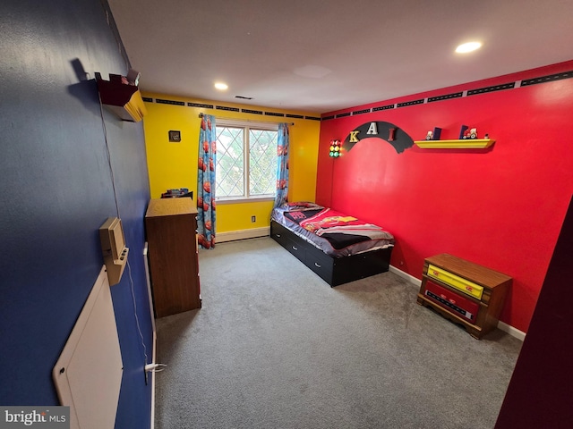 carpeted bedroom featuring a baseboard radiator