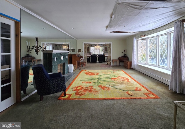 unfurnished living room featuring baseboard heating, a wealth of natural light, and carpet