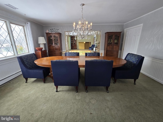 dining space with a baseboard heating unit, crown molding, a chandelier, and carpet flooring