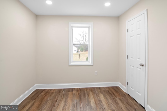 spare room featuring dark hardwood / wood-style floors