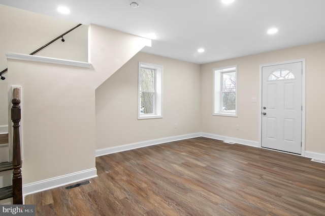 foyer featuring dark wood-type flooring